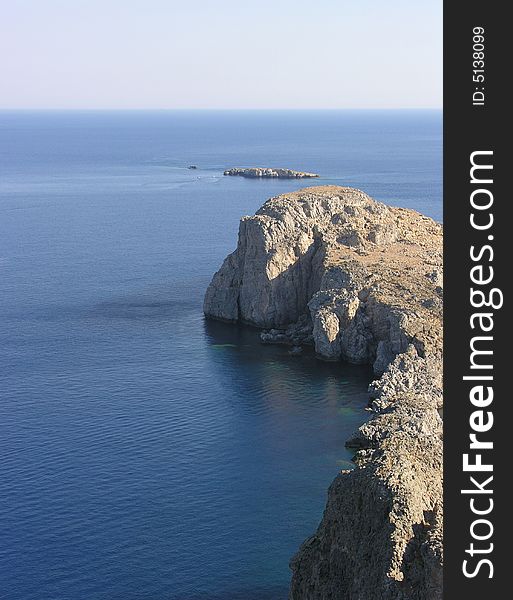 View of a bay in Lindos. Rhodes island in Greece. View of a bay in Lindos. Rhodes island in Greece.