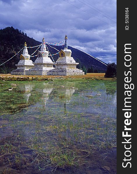 White pagodas by the lake