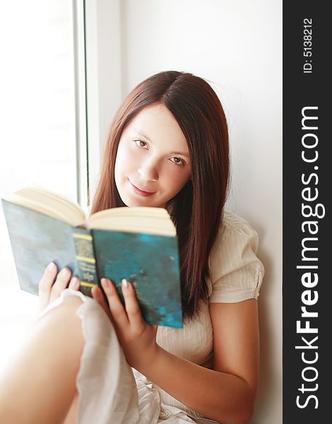 Beautiful girl with book: education, fashion. Beautiful girl with book: education, fashion.