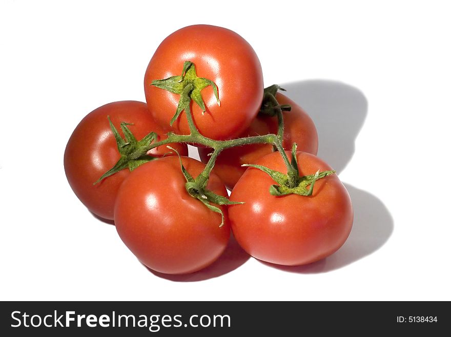 Ripe tomatoes against the white background