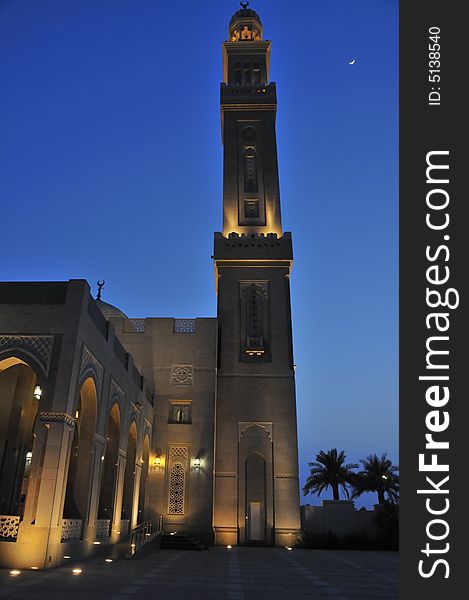 The sun has set and the call to prayer has sounded. The crescent moon is high in the sky next to the minaret of this mosque. The sun has set and the call to prayer has sounded. The crescent moon is high in the sky next to the minaret of this mosque.