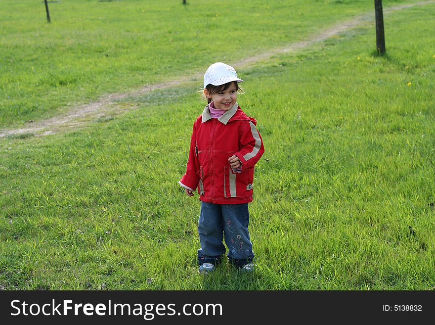 Little girl is walking in the park. Little girl is walking in the park
