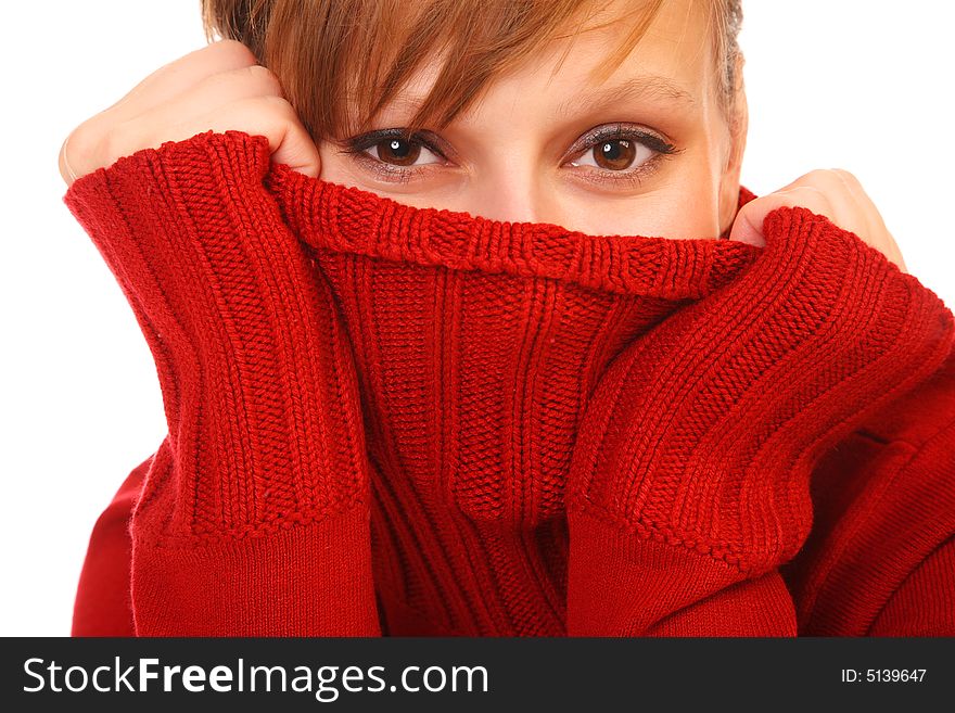 Smiling beautiful young woman  in red sweater on white background
