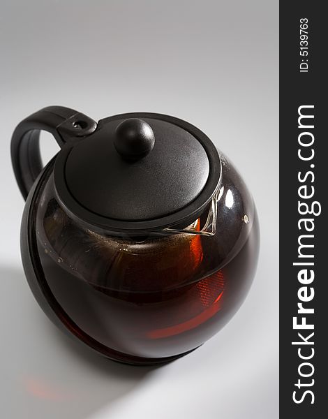 Strong black tea in a fashionable teapot