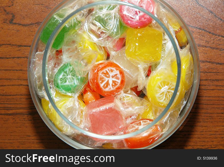 A jar filled with colorful candies. A jar filled with colorful candies