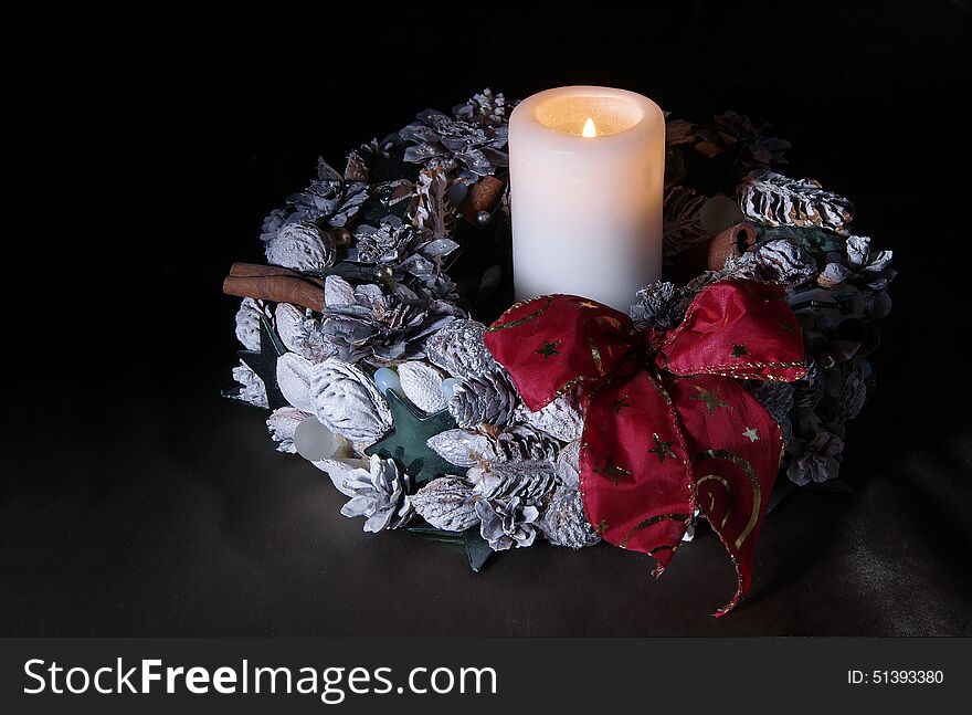 Christmas wreath with one candle