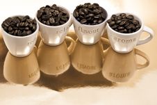 Coffee Beans In Cups Stock Photography