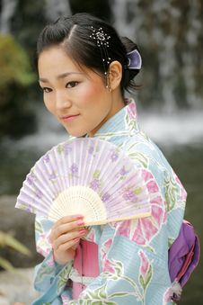 Asian Girl In A Komona Stock Photo