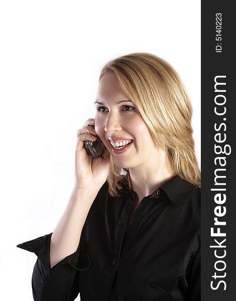Blonde girl talking and smiling on cel phone. Blonde girl talking and smiling on cel phone.