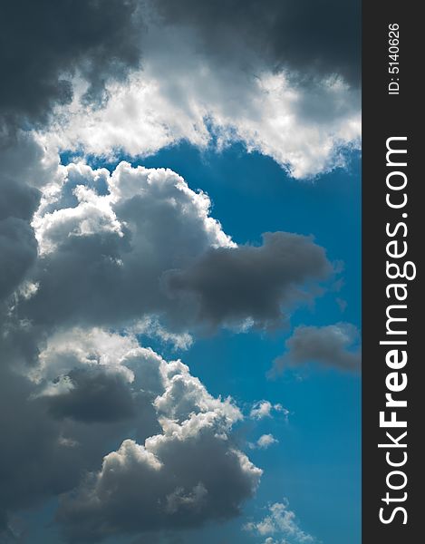 Contrast peaceful cloudscape, dramatic sky just after storm. Contrast peaceful cloudscape, dramatic sky just after storm