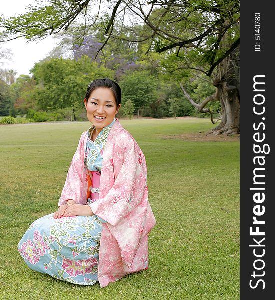 Young Asian girl in a traditional kimono. Young Asian girl in a traditional kimono