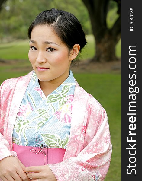 Young Asian girl in a traditional kimono. Young Asian girl in a traditional kimono