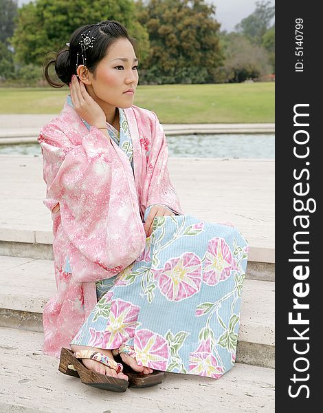 Young Asian girl in a traditional kimono. Young Asian girl in a traditional kimono