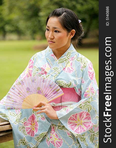 Young Asian girl in a traditional kimono. Young Asian girl in a traditional kimono