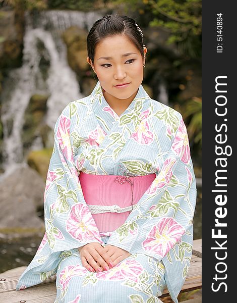 Young Asian girl in a traditional kimono. Young Asian girl in a traditional kimono