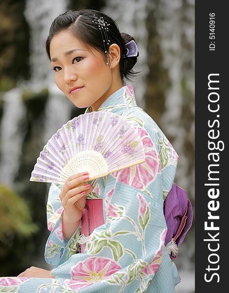 Young Asian girl in a traditional kimono. Young Asian girl in a traditional kimono