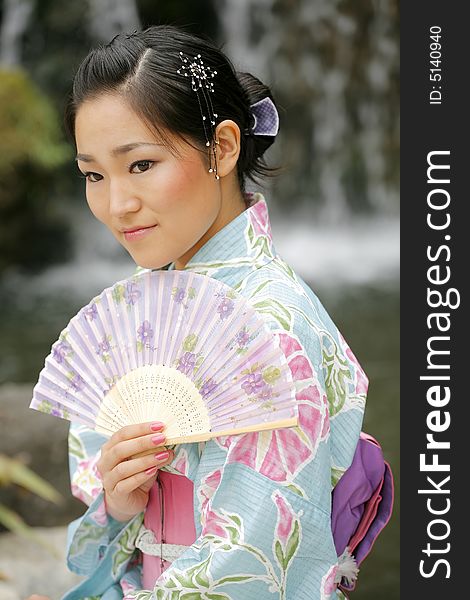 Young Asian girl in a traditional kimono. Young Asian girl in a traditional kimono