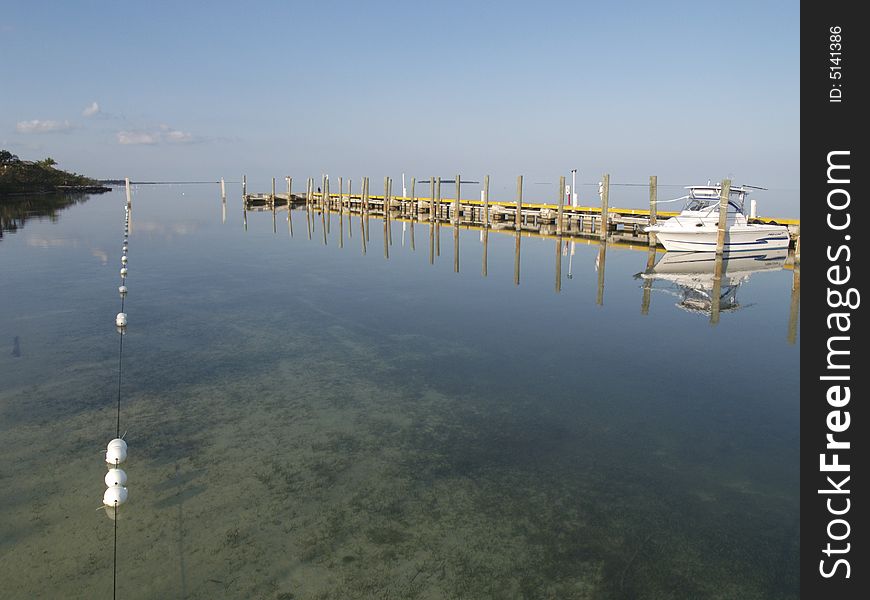 Photo taken early morning at marina in Key Largo, Florida. Water gets choppy later in the day but early morning was ripple free and crystal clear. Photo taken early morning at marina in Key Largo, Florida. Water gets choppy later in the day but early morning was ripple free and crystal clear.