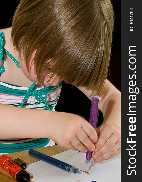 Cute little girl drawing in an education concept. Cute little girl drawing in an education concept