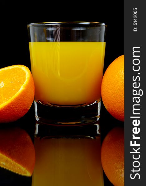 Orange juice isolated against a black background