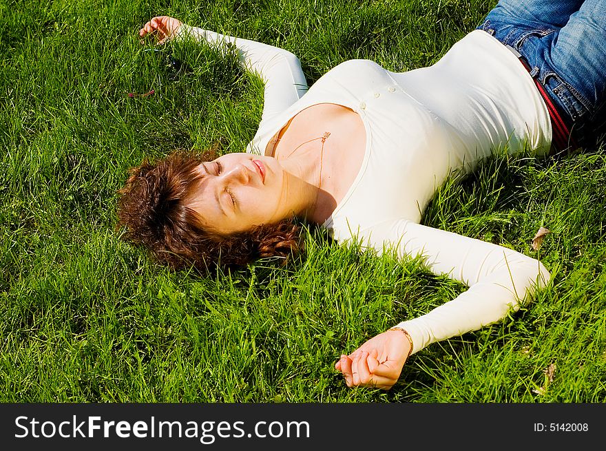 Attractive Girl On The Grass