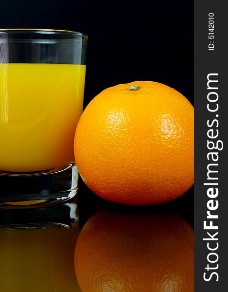 Orange juice isolated against a black background