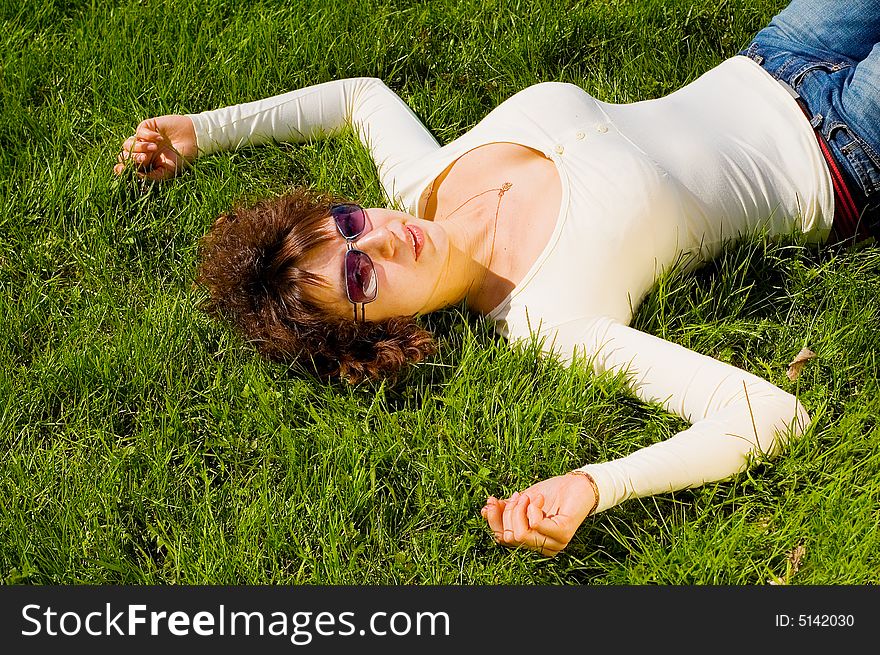 Girl Is Relaxing On The Grass