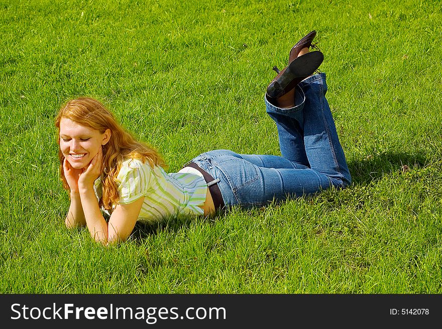 Girl Is Relaxing On The Grass