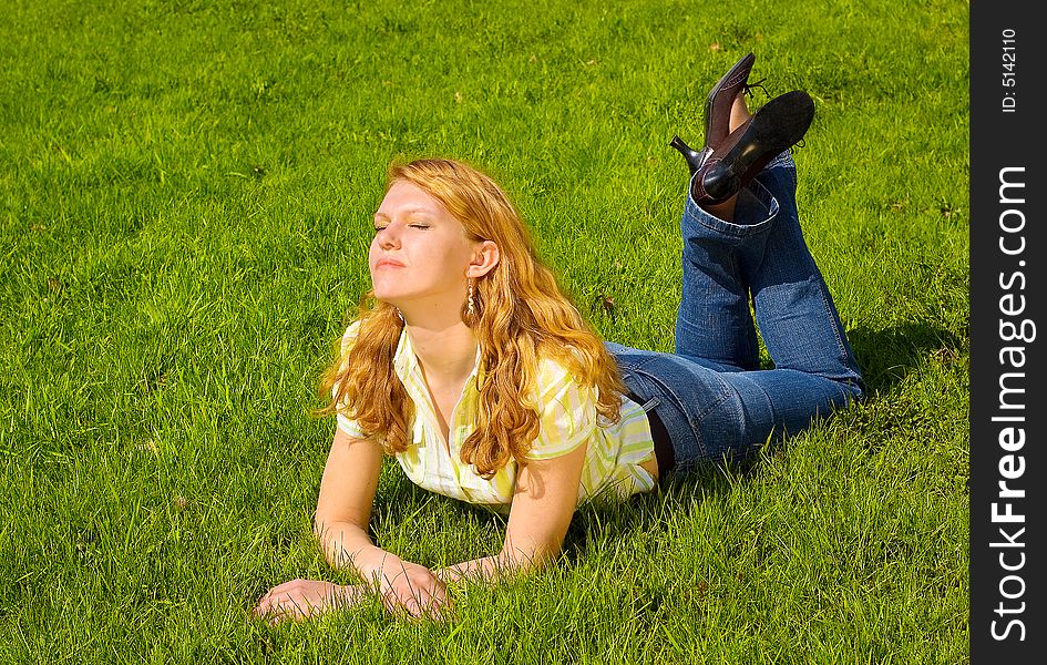 Girl Is Relaxing On The Grass