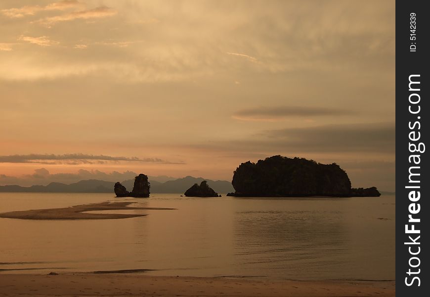 Sun setting over rocky islands and sand bar of Tanjung Rhu beach, Langkawi. Sun setting over rocky islands and sand bar of Tanjung Rhu beach, Langkawi