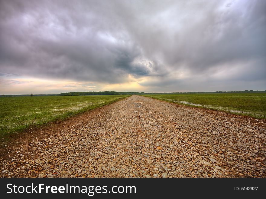 Field during sunset with path