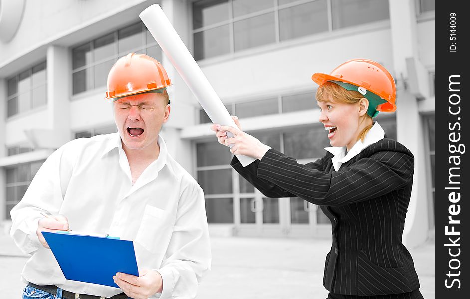 Architects man and woman protective helmet