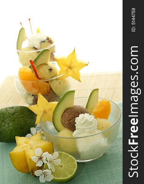 Ice cream with fresh fruits in a bowl close up. Ice cream with fresh fruits in a bowl close up