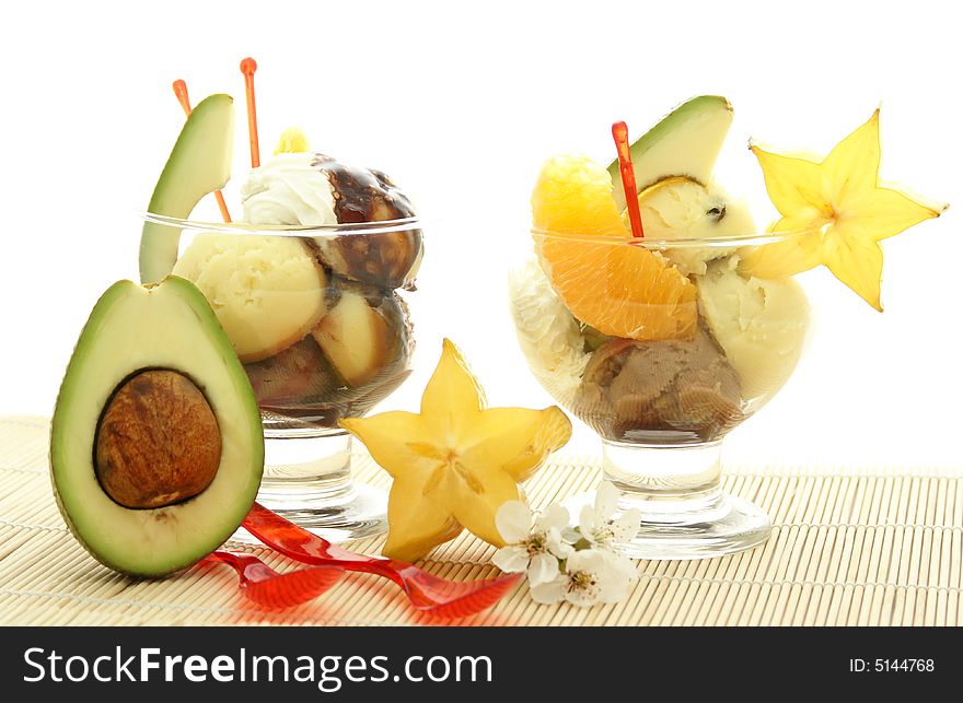 Ice cream with fresh fruits in a bowl close up. Ice cream with fresh fruits in a bowl close up