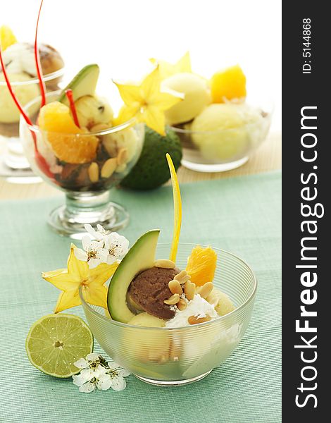 Ice cream with fresh fruits in a bowl close up. Ice cream with fresh fruits in a bowl close up