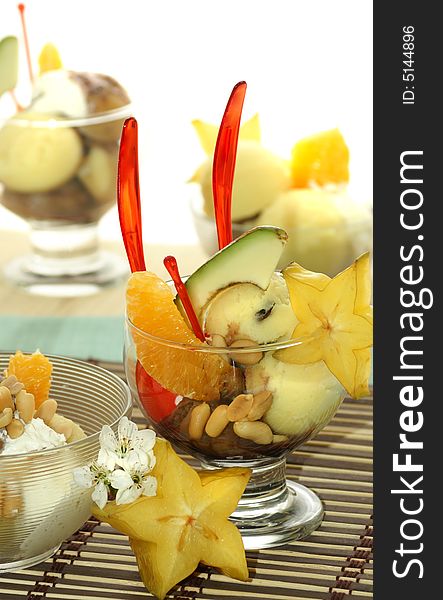 Ice cream with fresh fruits in a bowl close up. Ice cream with fresh fruits in a bowl close up