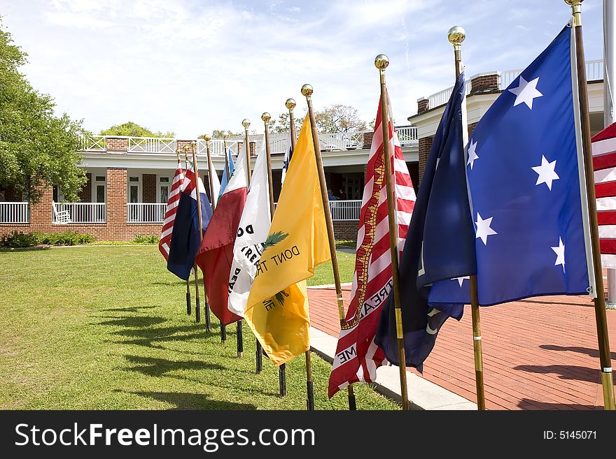 A display of historical American flags at an exhibit. A display of historical American flags at an exhibit