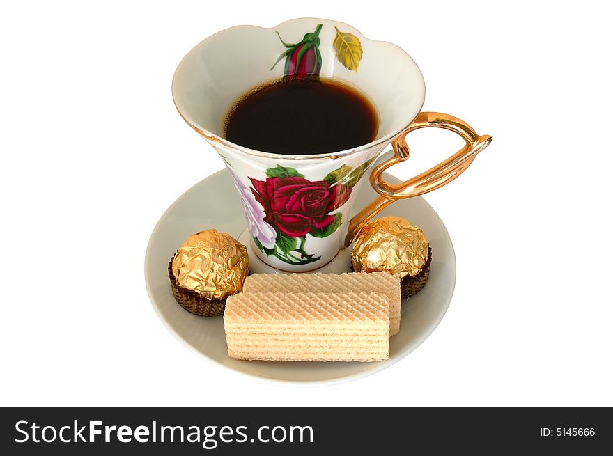 Old china cup of tea (or coffee) and sweeties on isolated background. Old china cup of tea (or coffee) and sweeties on isolated background.