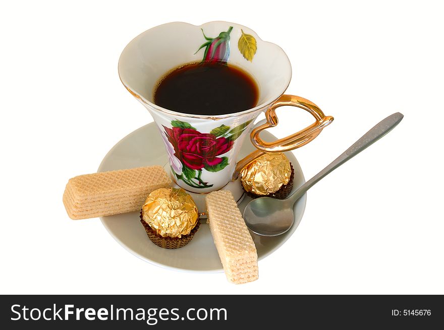Old china cup of tea (or coffee) and sweeties on isolated background. Old china cup of tea (or coffee) and sweeties on isolated background.