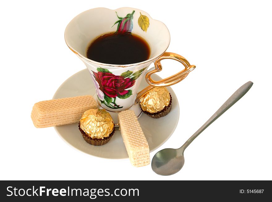 Old china cup of tea (or coffee) and sweeties on isolated background. Old china cup of tea (or coffee) and sweeties on isolated background.