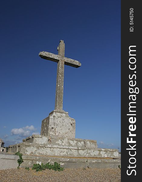 Big cross isolated in blue sky