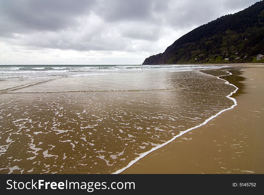 Gentle waves lapping the shore in central Oregon