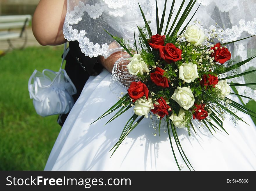 Just Married. Hands and bridal bouquet