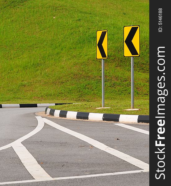 Traffic road signs and chevron markings. Traffic road signs and chevron markings