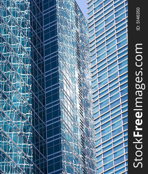 Modern skyscraper on blue sky background. Copy space on left top.