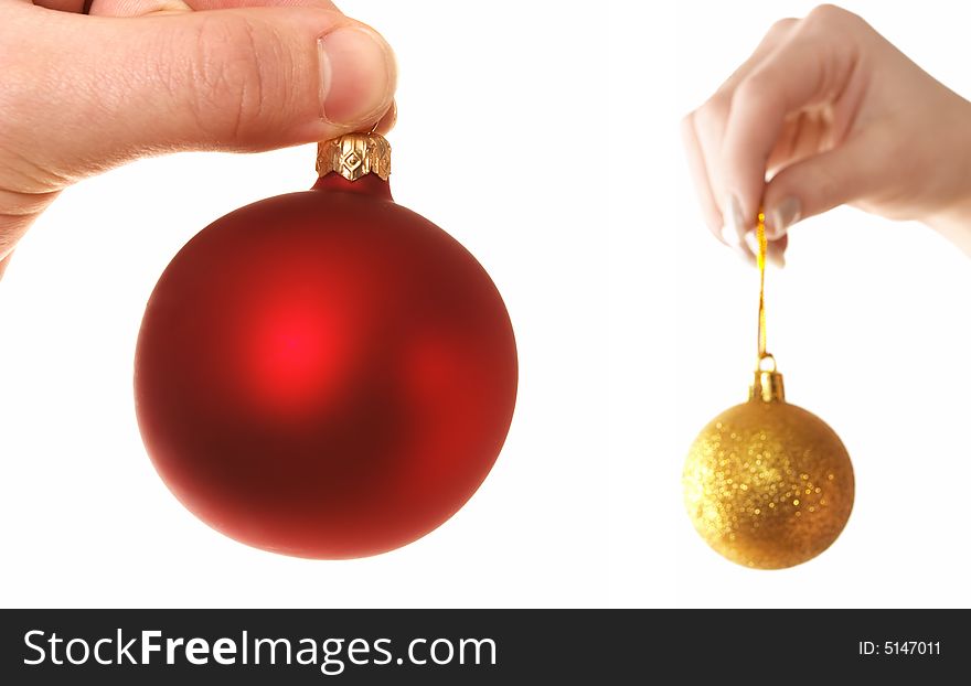 Hands holding Christmas balls isolated over white
