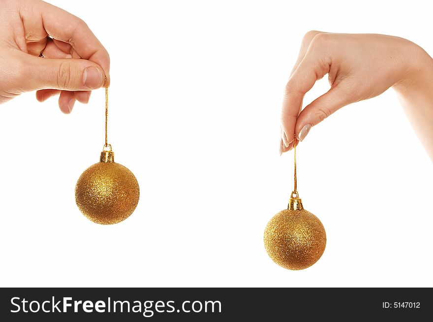 Hands holding Christmas balls isolated over white