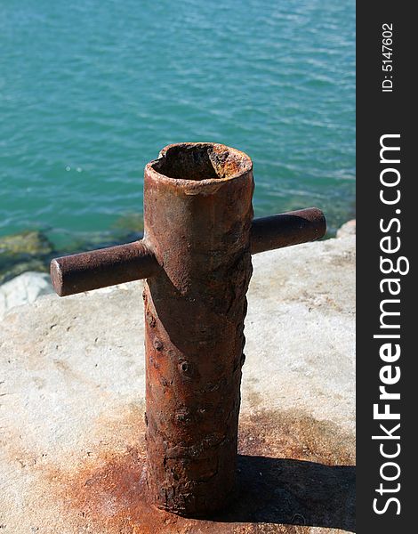 Old and Rusted Boat Anchor Pole at the harbour