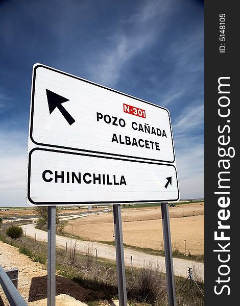 Direction sign pointing cities at a highway of spain. Direction sign pointing cities at a highway of spain