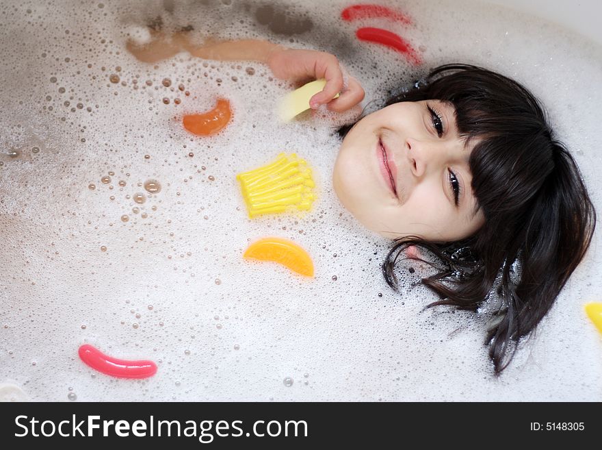 Girl having fun in the bathtub. Girl having fun in the bathtub